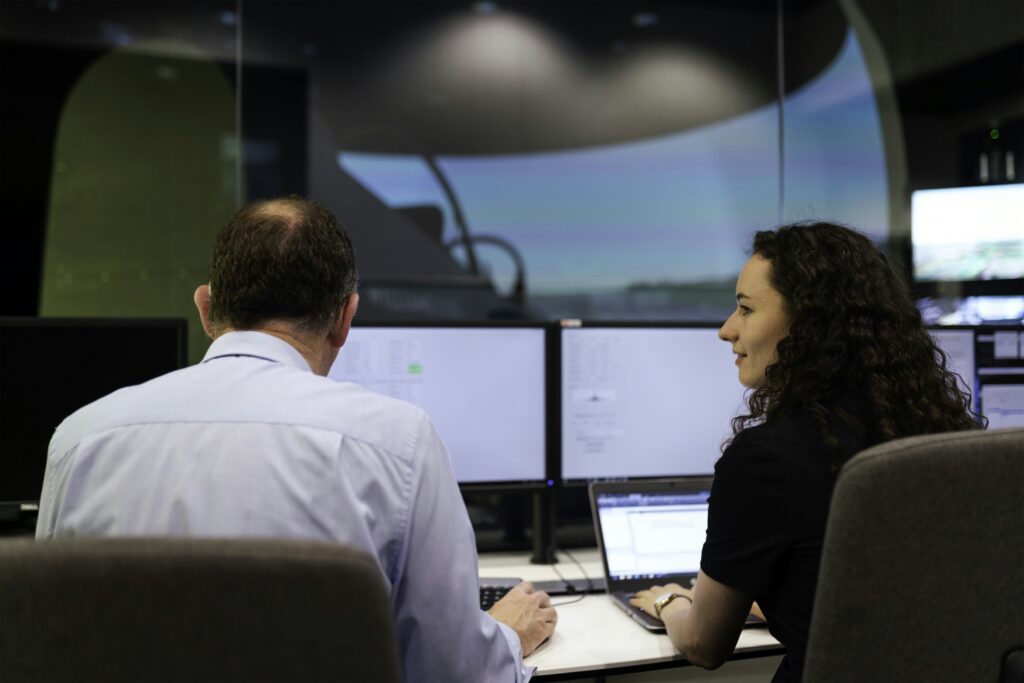 Aviation professionals working at flight-operations screens
